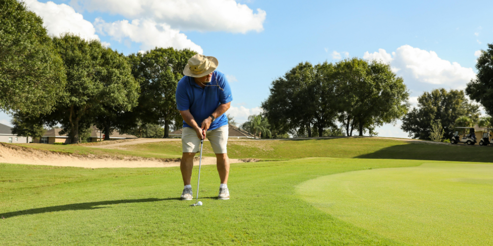 Man playing golf on course
